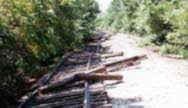 Photo by KDOT (Rail Affairs) in Washington County 1993.  The shoulder is washed out and the track was moved by running rain water.